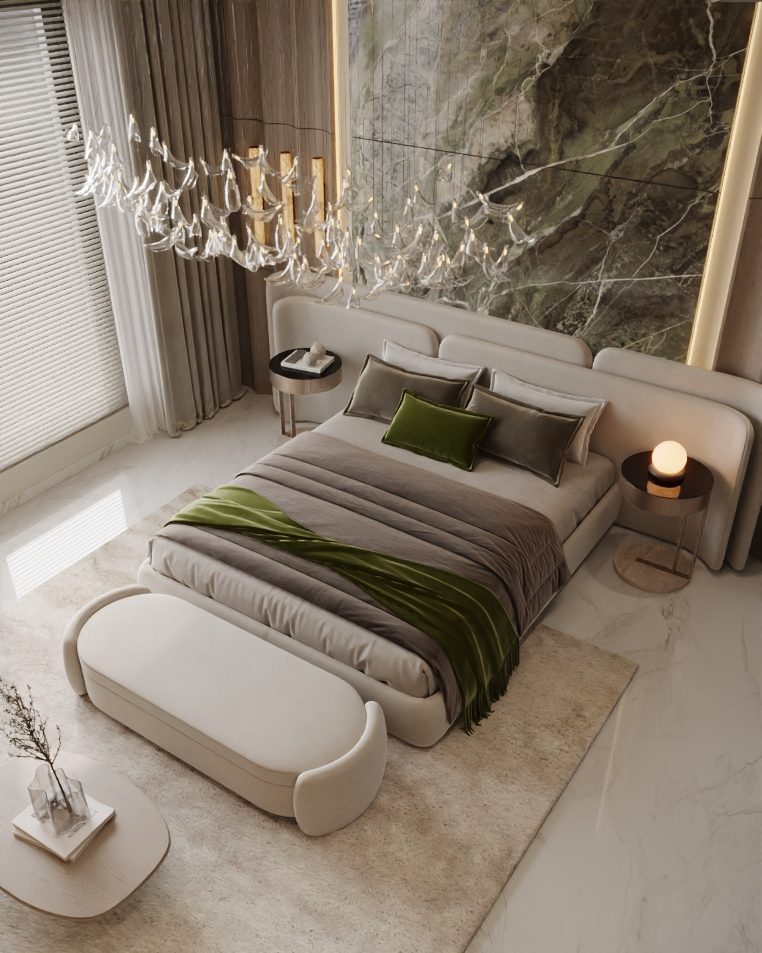 Bedroom seen from above with a cream bench and green accents